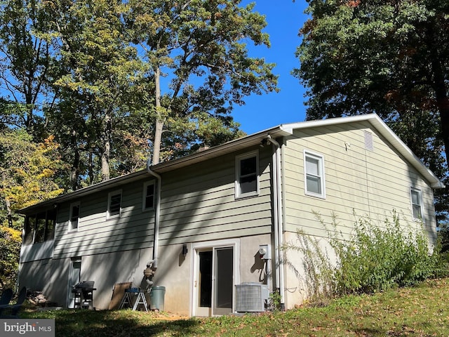 view of property exterior with central AC