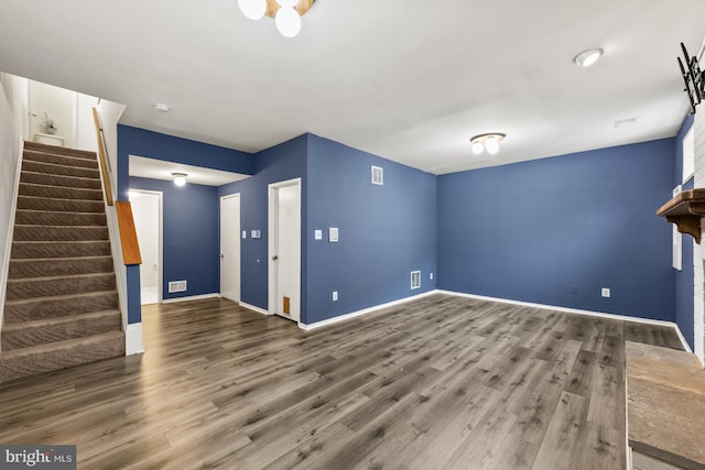 unfurnished living room featuring dark wood-type flooring