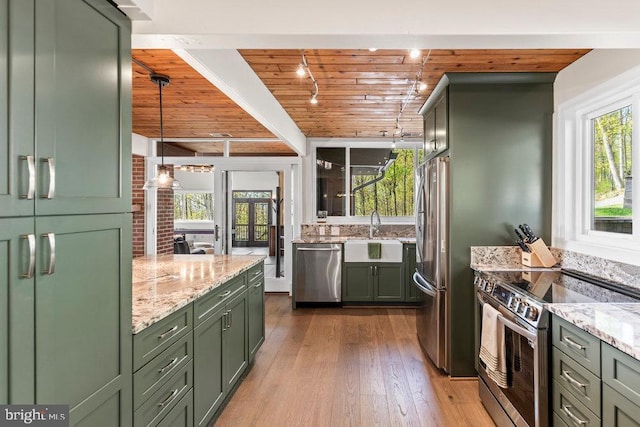 kitchen with decorative light fixtures, sink, green cabinets, appliances with stainless steel finishes, and wooden ceiling