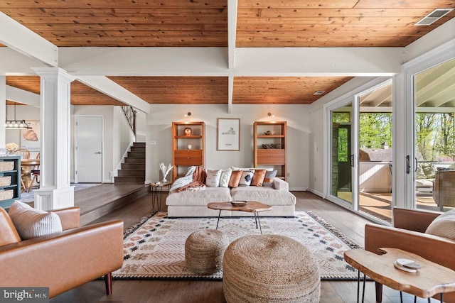 living room with ornate columns, hardwood / wood-style flooring, and wooden ceiling