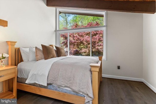 bedroom with dark hardwood / wood-style flooring