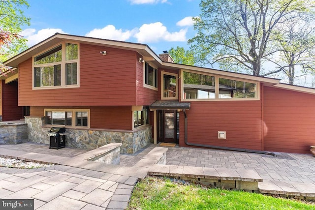 rear view of property with a patio