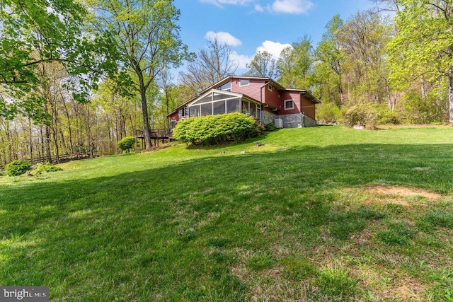 view of yard with a sunroom