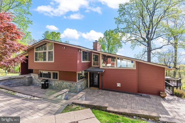 rear view of house featuring a patio area