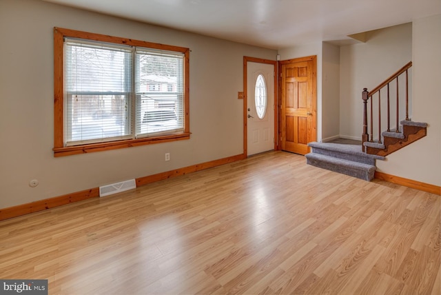 entryway featuring light hardwood / wood-style floors and plenty of natural light