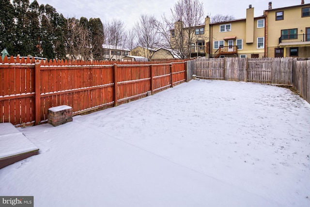 view of yard covered in snow