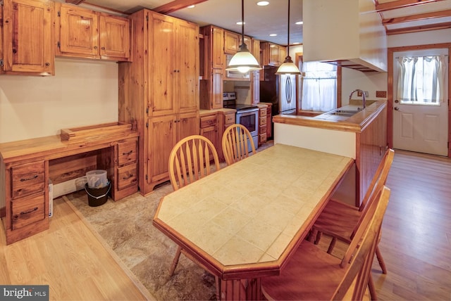 interior space featuring sink and light hardwood / wood-style flooring