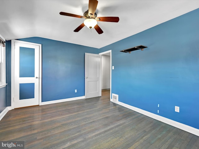 interior space with ceiling fan, dark wood-type flooring, and vaulted ceiling