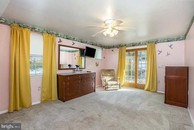 sitting room featuring light carpet and ceiling fan