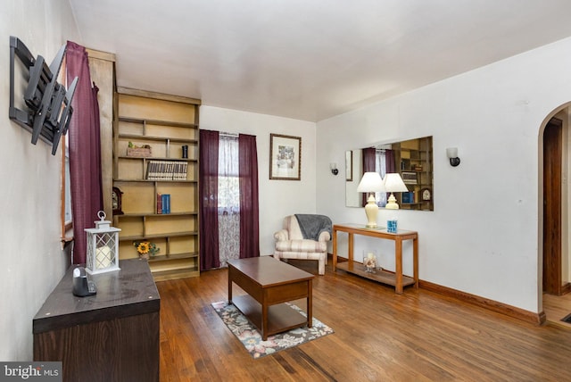 living area with dark wood-type flooring