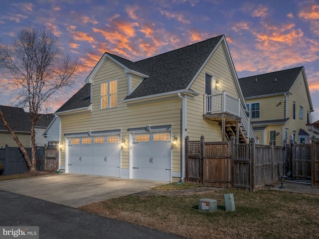 property exterior at dusk featuring a garage