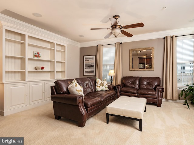 living room featuring crown molding, light colored carpet, and ceiling fan