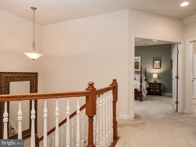 corridor with light colored carpet