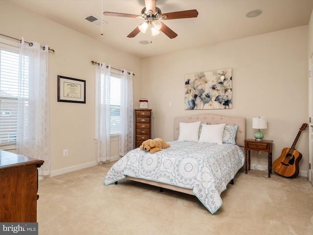 bedroom with light colored carpet and ceiling fan