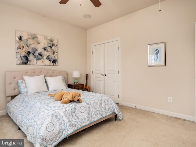 bedroom with carpet floors, a closet, and ceiling fan