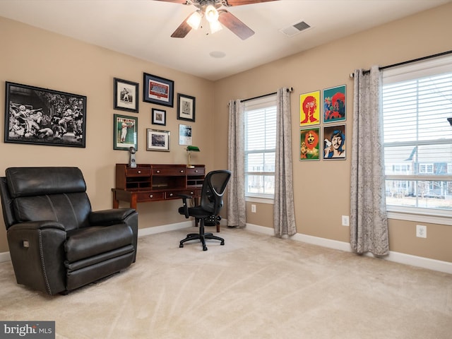 home office with light colored carpet and ceiling fan