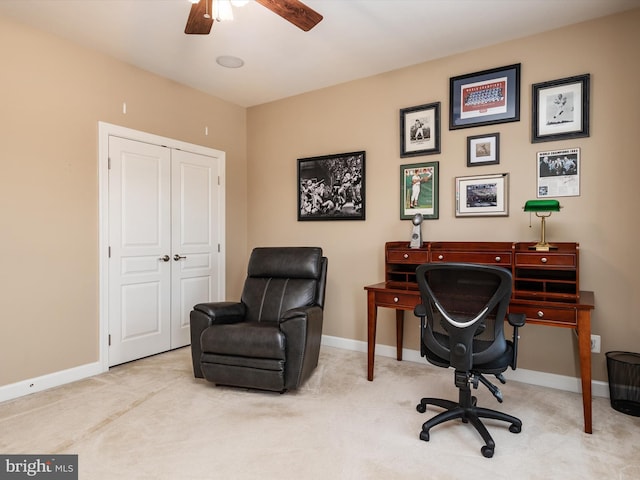 carpeted office with ceiling fan