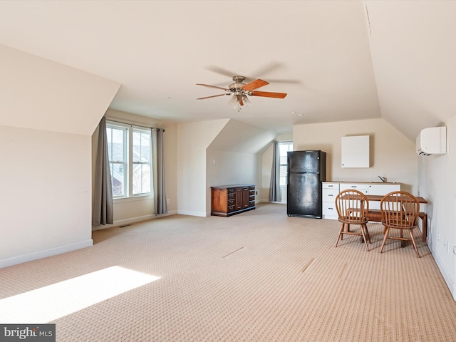 bonus room featuring a wall mounted air conditioner, vaulted ceiling, light colored carpet, and ceiling fan