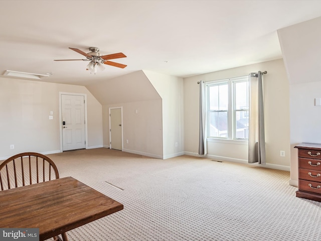 bonus room with vaulted ceiling, light colored carpet, and ceiling fan