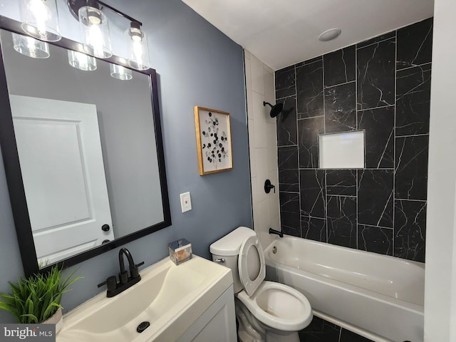 full bathroom featuring toilet, tile patterned floors, tiled shower / bath, and vanity