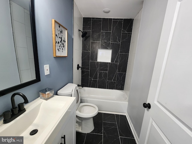 full bathroom with tiled shower / bath combo, vanity, and toilet