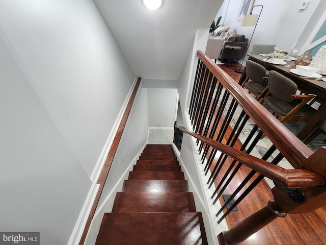 stairs with wood-type flooring