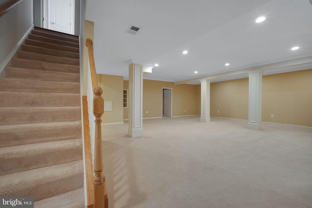 finished below grade area featuring recessed lighting, light colored carpet, visible vents, stairway, and baseboards