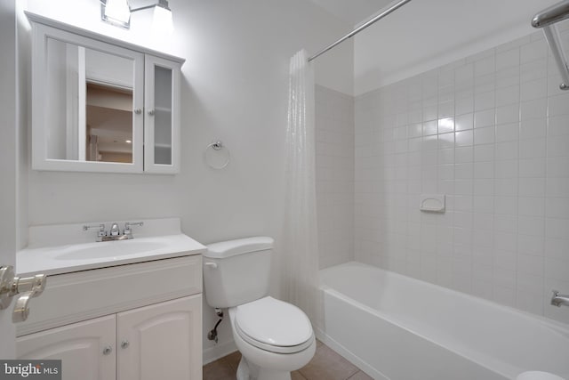 full bathroom featuring shower / tub combo, tile patterned flooring, vanity, and toilet