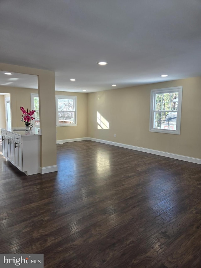 interior space with dark hardwood / wood-style floors and sink