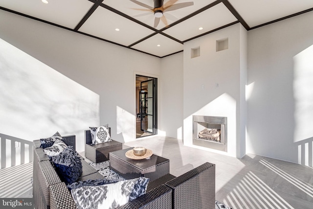 carpeted living area with exterior fireplace, recessed lighting, crown molding, and ceiling fan