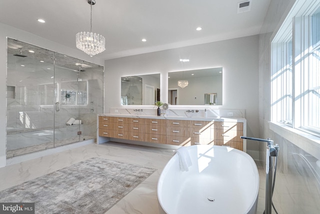 full bath with double vanity, marble finish floor, a marble finish shower, and a chandelier