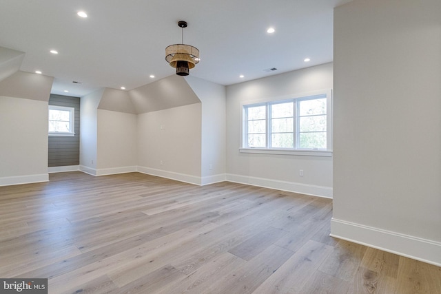 bonus room featuring recessed lighting, baseboards, and light wood-style floors