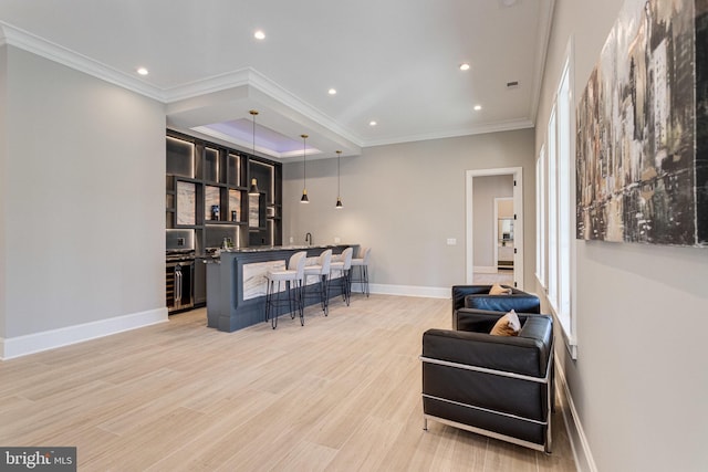 bar featuring baseboards, ornamental molding, indoor wet bar, recessed lighting, and light wood-style floors