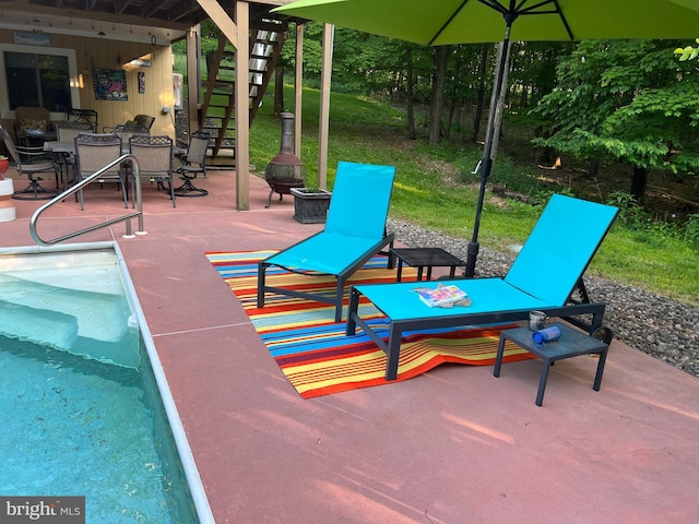 view of patio / terrace featuring a fire pit