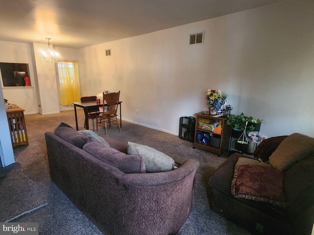 living room with carpet floors and an inviting chandelier