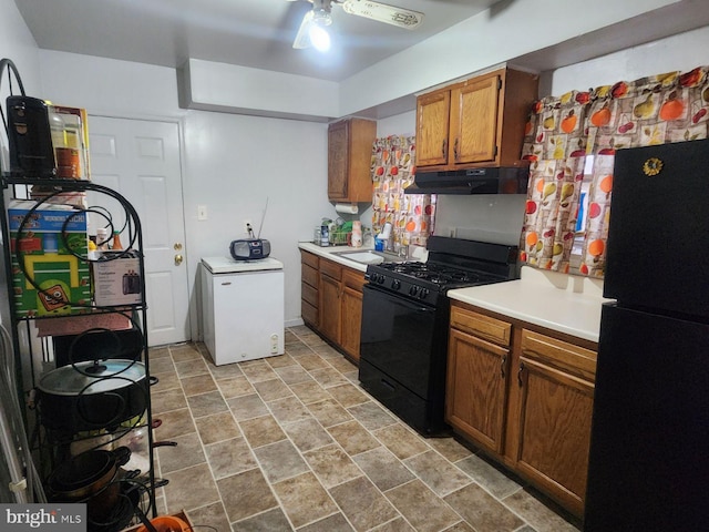 kitchen with ceiling fan, sink, and black appliances