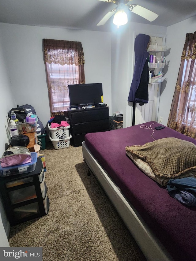 carpeted bedroom with ceiling fan