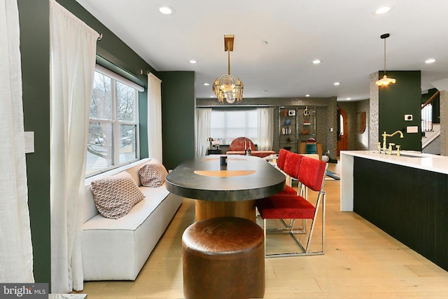 dining room with sink and light hardwood / wood-style floors