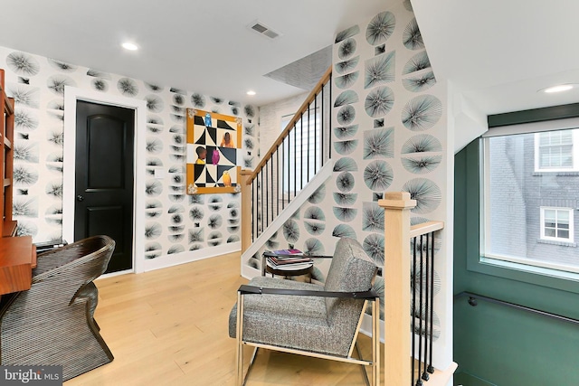 staircase with wood-type flooring