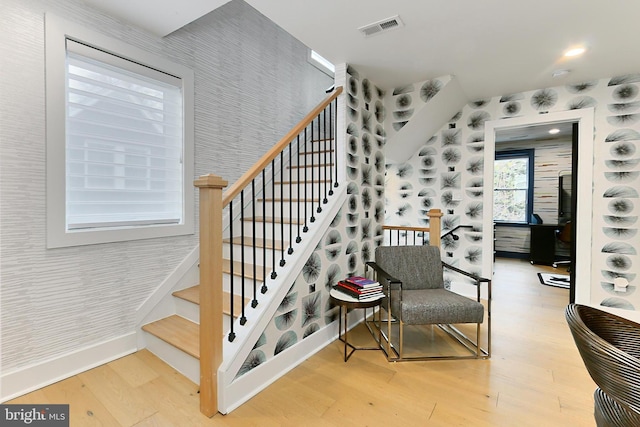 stairway featuring hardwood / wood-style flooring