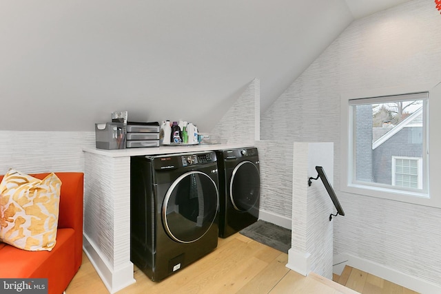 laundry area featuring separate washer and dryer and light wood-type flooring