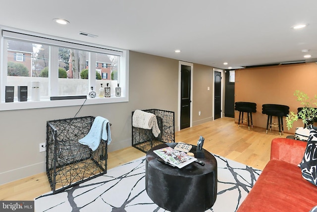 living room with light hardwood / wood-style floors