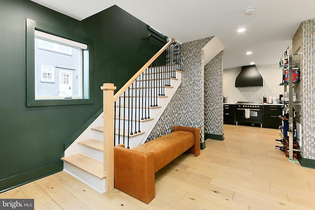 staircase featuring hardwood / wood-style floors