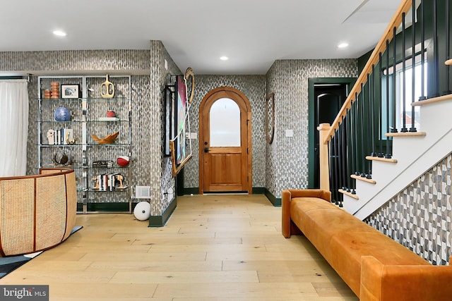 foyer entrance with light hardwood / wood-style floors