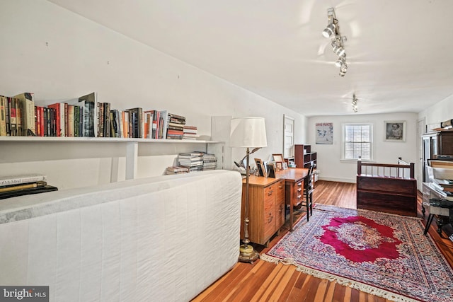 office featuring track lighting and wood-type flooring