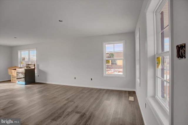 spare room with hardwood / wood-style floors