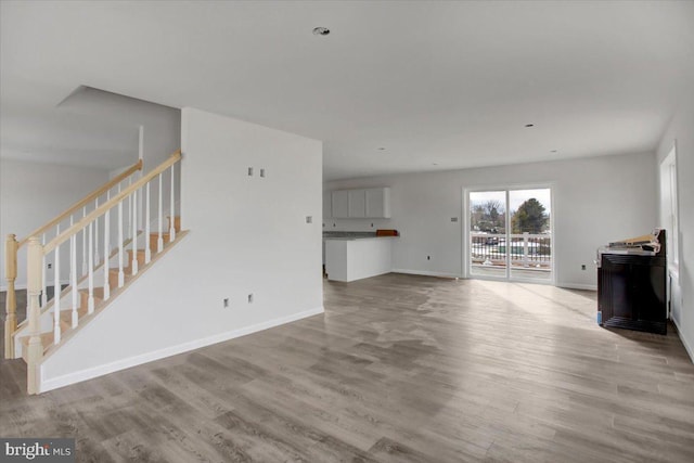 unfurnished living room featuring light wood-type flooring