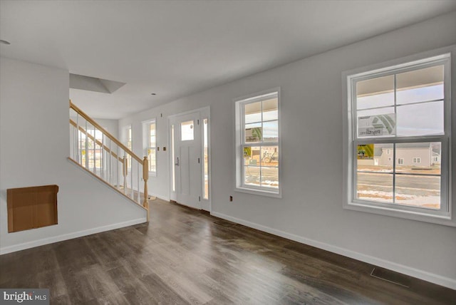 foyer entrance featuring dark hardwood / wood-style flooring