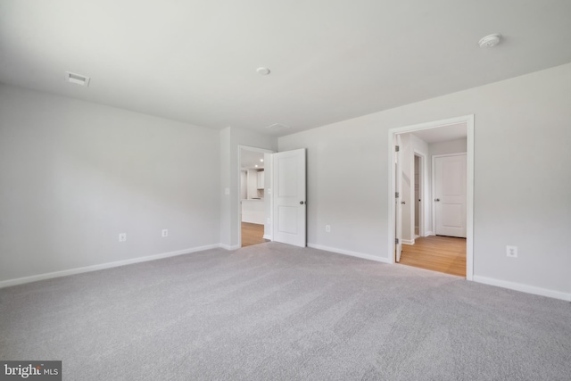 unfurnished bedroom with light carpet