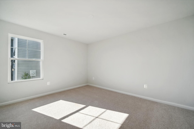 spare room with carpet flooring